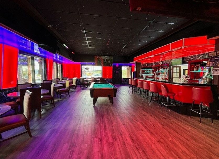 OYO Hotel Wade/Fayetteville I-95 South lounge with pool table and red-lit bar in Fayetteville