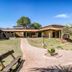 Hotel Fazenda Areia que Canta in Brotas with a curved path, lawn, benches, and palm trees