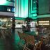 Adana Garden Business Hotel in Adana with illuminated rooftop terrace seating at night