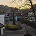 Hotel Sonne Post in Murrhardt with courtyard view at sunset and surrounding hillside homes
