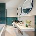 The Chancery Hotel Dublin bathroom with freestanding tub, double sinks and round mirrors