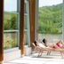 Villaggio Della Salute Più in Monterenzio: spa loungers by large windows with green hillside views