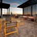 Rooftop terrace at Home2 Suites by Hilton Albuquerque Airport with lounge seating and sunset views
