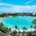 Playa Blanca Beach Resort in Río Hato with a large turquoise lagoon-style pool and palm trees