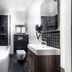Qudos Salisbury bathroom with bathtub, walk-in shower, wall-mounted toilet and sink