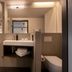 Pierdrei Hotel Hafencity Hamburg bathroom with walk-in shower, sink, toilet and modern lighting