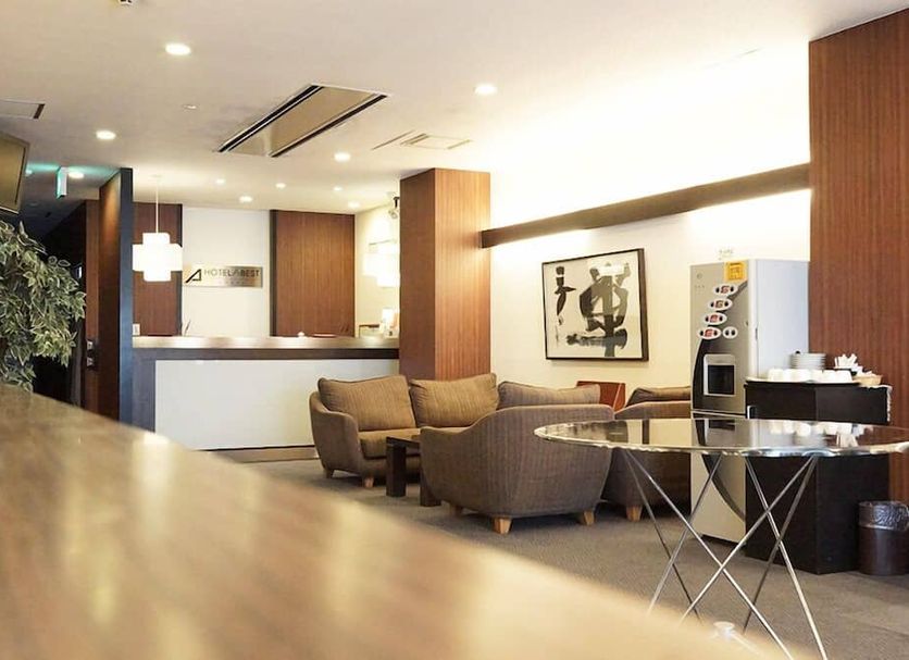 Hotel Abest Kochi lobby with seating area, front desk, and coffee station in Kochi