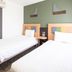 Comfort Hotel Narita in Narita guest room with two twin beds and a small bedside table