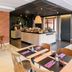Campanile Nature - Cahors dining room with tables, buffet counter, brick wall and patio doors