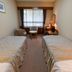 Inuyama International Youth Hostel room in Inuyama with two single beds, window seating and desk lamp