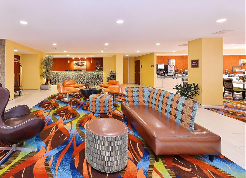 Best Western Plus Fresno Airport Hotel in Fresno lobby lounge with colorful patterned carpet and leather seating