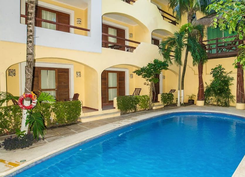 Hotel Riviera Caribe Maya in Playa del Carmen with courtyard pool and arched balconies