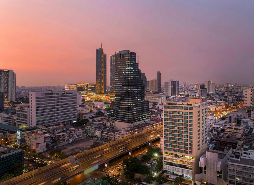 Hilton Garden Inn Bangkok Silom city skyline view at sunset in Bangkok