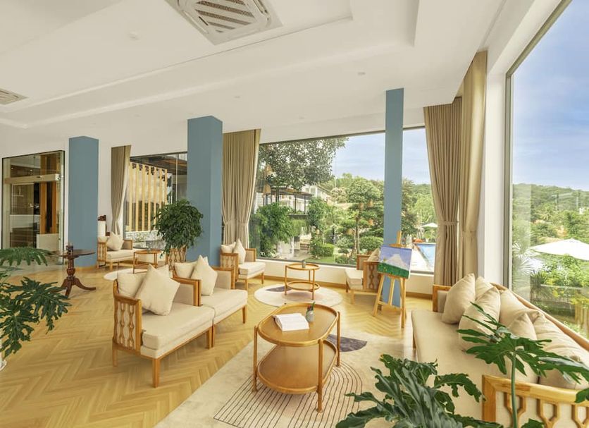 Tom Hill Boutique Resort & Spa in Phu Quoc lounge with large windows and hillside views