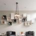 B&B Hotel Milano-Monza lobby seating area in Monza with modern wall shelves and pendant lights