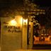 Baan Hanibah hotel entrance in Chiang Mai at night with warmly lit courtyard seating