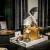 AC Hotel Fort Worth Downtown dining table centerpiece with gold decor and feather arrangement