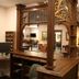 Hearthstone Elegant Lodge by the River in Kamiah: ornate lobby with carved wood staircase and mezzanine