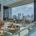 137 Pillars Residences Bangkok rooftop terrace with lounge seating and Bangkok skyline views
