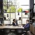 Aparthotel Adagio Access Palaiseau Saclay meeting area with shelves, large windows and two people talking