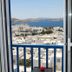 Portobello Boutique Hotel in Mykonos balcony view of whitewashed buildings and blue sea
