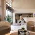 Hotel Du Port in Nogent-sur-Marne lobby with curved front desk, seating area, and tall windows