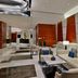 Hilton Dubai The Walk lobby lounge in Dubai with white sofas, marble floors, and modern orange wall panels
