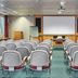Kents Hill Park Training & Conference Centre in Milton Keynes conference room with rows of chairs and projection screen