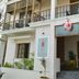 Cours Chabrol A Heritage Hotel By The Sea, Pondicherry, facade with balcony, entrance, and potted plants