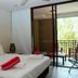 Private Sea Temple Studio King Studio 423 in Palm Cove: king bed, balcony with tropical view