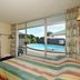 Raceway Motel Whanganui room with pool view through sliding glass doors