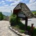 Hotel & Chalets Herrihof in Todtnau with a paved terrace and mountain valley view