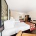 Super 8 by Wyndham Florida City/Gateway to Keys/Everglades room with two beds, desk and mirror in Florida City