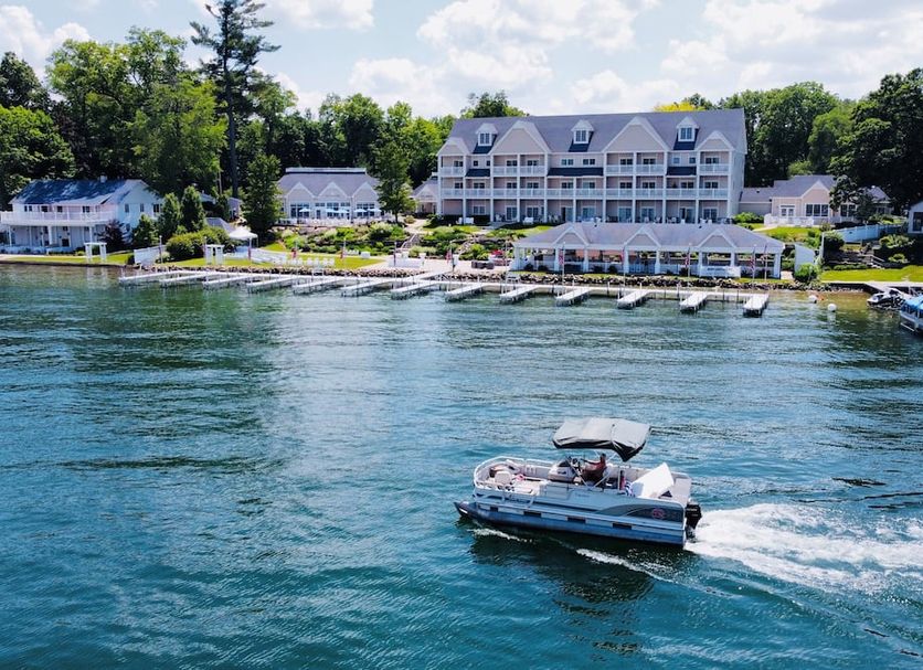 Bay Pointe Inn in Shelbyville with lakeside dock, boat slips, and a boat on the water