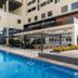 Studio One Hotel Dubai outdoor pool beside Pizzas restaurant and modern hotel courtyard