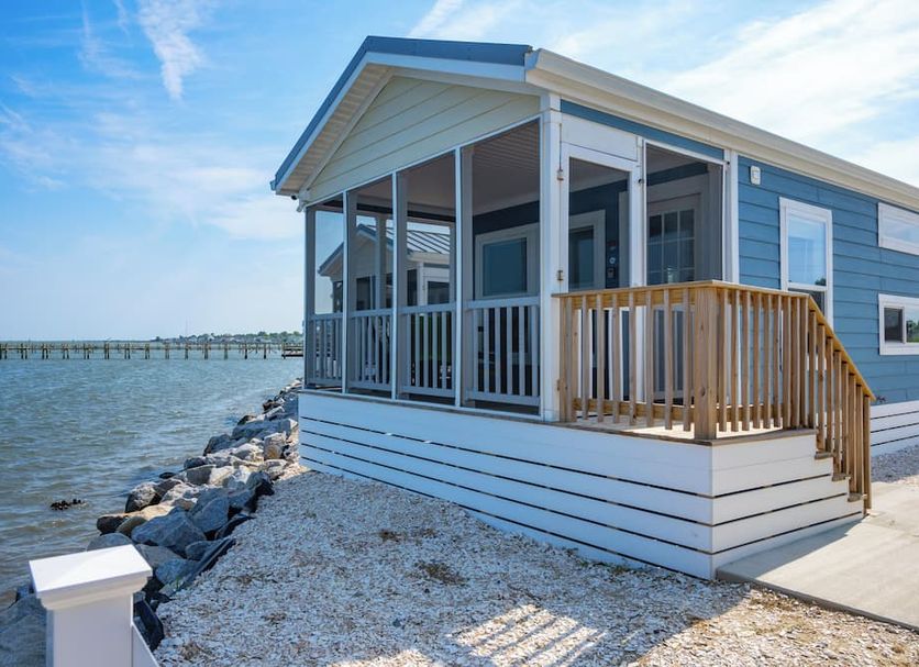 Blufin Bungalows & Marina in Chincoteague with waterfront bungalow, screened porch and marina view