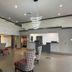 Ramada by Wyndham Tuscaloosa lobby with check-in desk and patterned lounge chairs