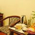 A25 Hotel Mai Hac De room in Hanoi with chair, desk, TV, kettle and snack items