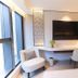 The Bauhinia Hotel - Central Hong Kong guest room with desk, TV, chairs, and large window