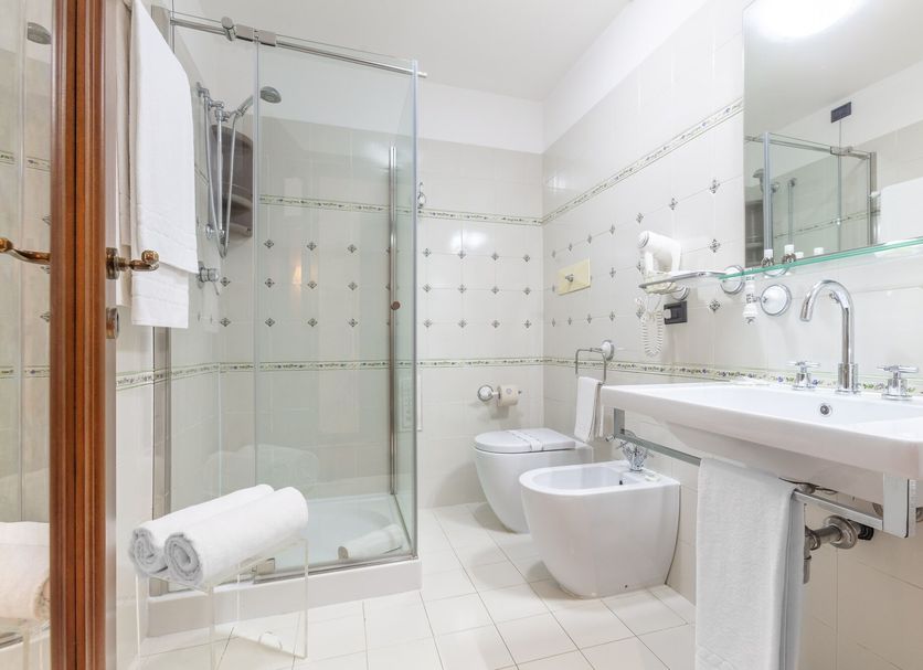 Hotel Ristorante La Pergola in Magliano Sabina bathroom with glass shower, bidet and sink