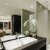 Downtown Villas Kuta bathroom with glass shower, vessel sink, orchid and mosaic tile walls