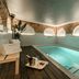 Hospes Puerta de Alcalá, Madrid indoor pool with arched brick walls and lounge seating