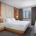 Wyndham Midtown 45 king room in New York with city view and modern bed setup
