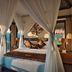 Nandini Jungle by Hanging Gardens, Payangan: canopy bed with jungle view and private balcony