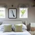 Tudor Farmhouse in Coleford guest room with white bed, green pillows, bedside lamps and wall art