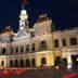 Funny Guesthouse in Ho Chi Minh City with a lit ornate colonial facade at night