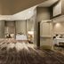 Embassy Suites by Hilton Phoenix Downtown North in Phoenix lobby lounge with purple seating and carpeted corridor