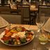 Hotel Asgard in Gersthofen dining table with salad platter, desserts, wine glass and folded napkins