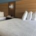 Jacksonville Inn & Suites in Jacksonville guest room with two beds and wood headboard