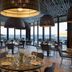 Cayo Exclusive Resort & Spa in Elounda dining room with sea views and woven pendant lights